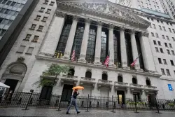 Wall Street recovers some of Friday’s sell-off after Trump softens his criticism of China